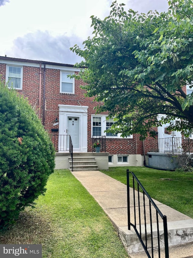 316 Whitfield Rd, Baltimore, MD 21228 - view of front of home featuring brick siding and a front lawn
