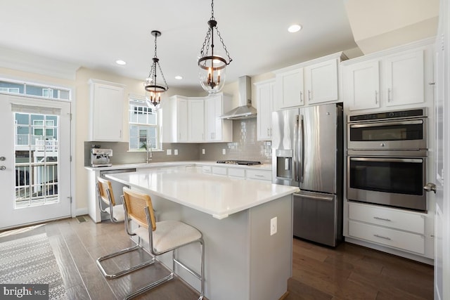 12150 Grey Squirrel St, Clarksburg, MD 20871 - kitchen with stainless steel appliances, wall chimney exhaust hood, healthy amount of natural light, a kitchen island, and recessed lighting