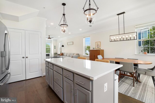 12150 Grey Squirrel St, Clarksburg, MD 20871 - kitchen featuring gray cabinets, stainless steel refrigerator, dark wood-type flooring, ornamental molding, and a chandelier