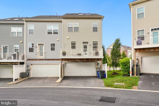 12150 Grey Squirrel St, Clarksburg, MD 20871 - rear view of house with a garage and driveway