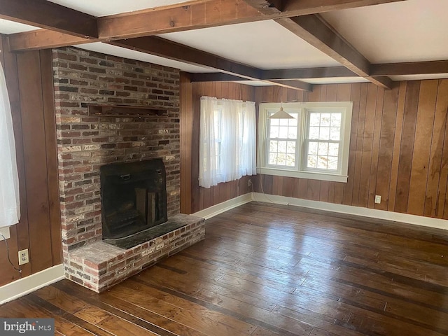 409 N Wawaset Rd, West Chester, PA 19382 - unfurnished living room featuring wood-type flooring, beamed ceiling, wooden walls, and a fireplace