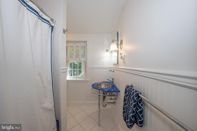 406 Devon State Rd, Devon, PA 19333 - bathroom featuring wainscoting, tile patterned floors, and a shower with shower curtain