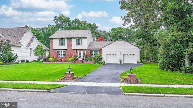 32 Lakeshore Dr, Hammonton, NJ 08037 - colonial-style house featuring a garage, brick siding, driveway, and a front lawn