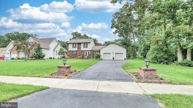 32 Lakeshore Dr, Hammonton, NJ 08037 - traditional-style home featuring a garage, a front lawn, driveway, brick siding, and a chimney
