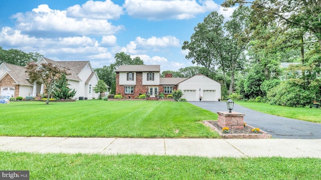 32 Lakeshore Dr, Hammonton, NJ 08037 - view of front facade featuring driveway, an attached garage, a front lawn, and brick siding