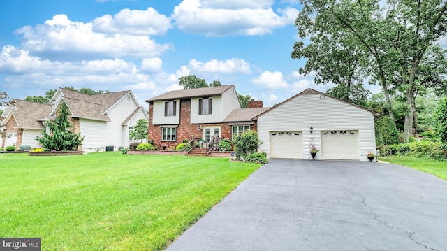 32 Lakeshore Dr, Hammonton, NJ 08037 - traditional-style house featuring brick siding, a garage, driveway, and a front lawn