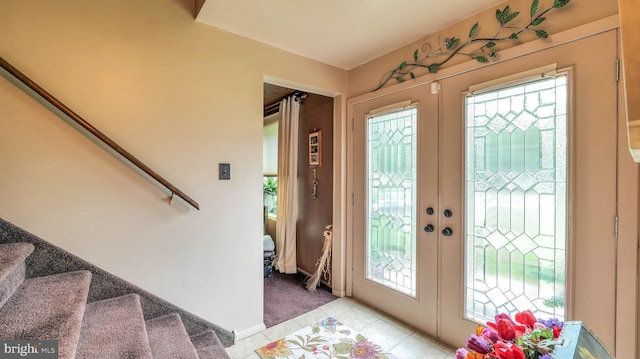 32 Lakeshore Dr, Hammonton, NJ 08037 - entrance foyer with stairway, light tile patterned flooring, french doors, and light carpet