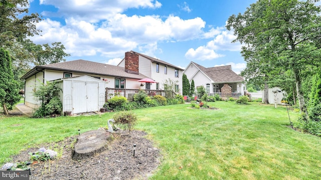 32 Lakeshore Dr, Hammonton, NJ 08037 - view of yard with a storage unit and a wooden deck