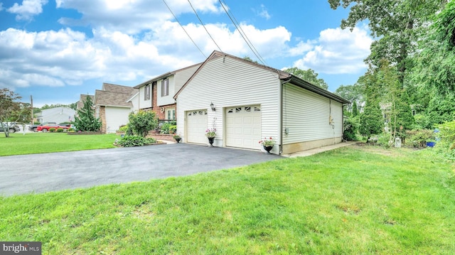 32 Lakeshore Dr, Hammonton, NJ 08037 - view of property exterior featuring asphalt driveway and a yard