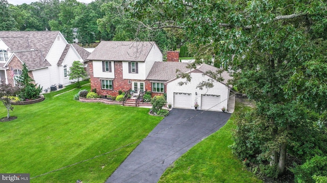 32 Lakeshore Dr, Hammonton, NJ 08037 - view of front of home with brick siding, driveway, a chimney, a front lawn, and french doors