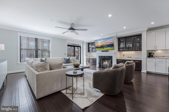 43561 Michigan Sq, Leesburg, VA 20176 - living room featuring ornamental molding, a high end fireplace, recessed lighting, dark wood-style flooring, and a ceiling fan