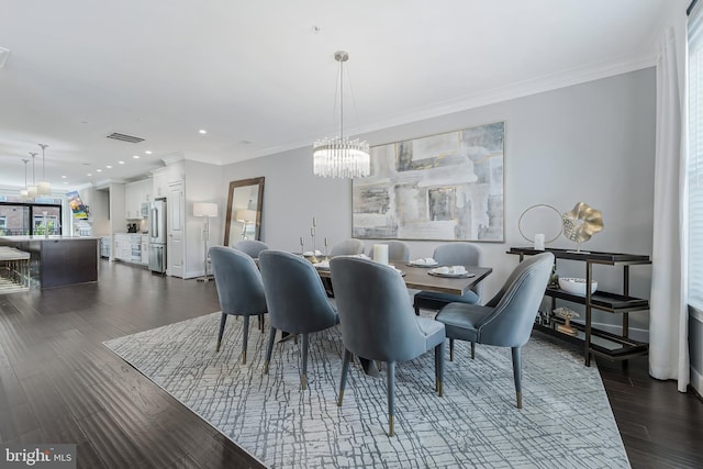 43561 Michigan Sq, Leesburg, VA 20176 - dining room with a chandelier, ornamental molding, dark wood-style floors, and recessed lighting