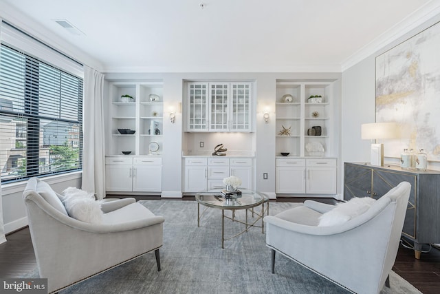 43561 Michigan Sq, Leesburg, VA 20176 - living area featuring built in features, dark wood-style flooring, and crown molding