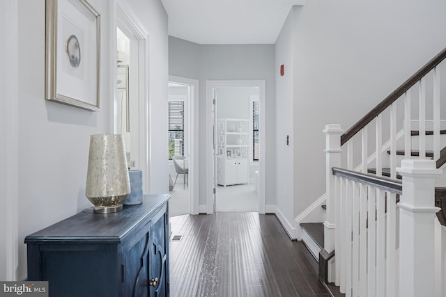 43561 Michigan Sq, Leesburg, VA 20176 - foyer entrance with dark wood-style floors and stairs