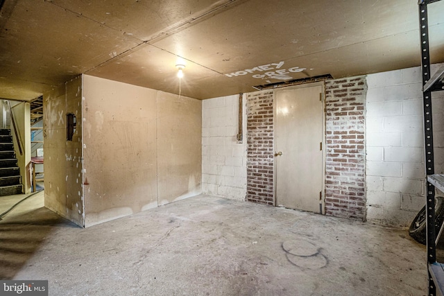 1531 Aiden Dr, Woodbridge, VA 22191 - unfinished below grade area featuring stairway and concrete block wall