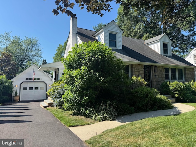 728 Stryker Ave, Doylestown, PA 18901 - view of front of house with stone siding, a garage, an outdoor structure, a chimney, and driveway