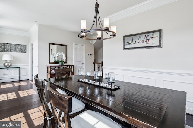 221 Patriots Path, Malvern, PA 19355 - dining area with a decorative wall, a chandelier, wood finished floors, a wainscoted wall, and ornamental molding