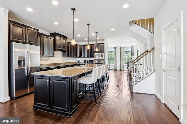 221 Patriots Path, Malvern, PA 19355 - kitchen with stainless steel appliances, dark wood finished floors, a large island, and recessed lighting