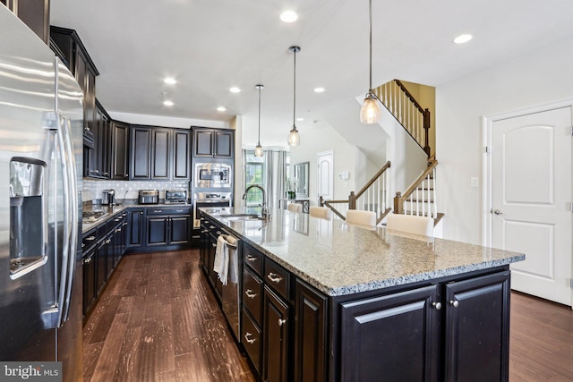 221 Patriots Path, Malvern, PA 19355 - kitchen with stainless steel appliances, dark wood-type flooring, decorative backsplash, a large island, and recessed lighting