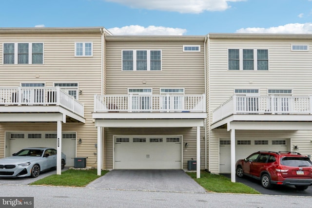 221 Patriots Path, Malvern, PA 19355 - rear view of property with an attached garage and driveway