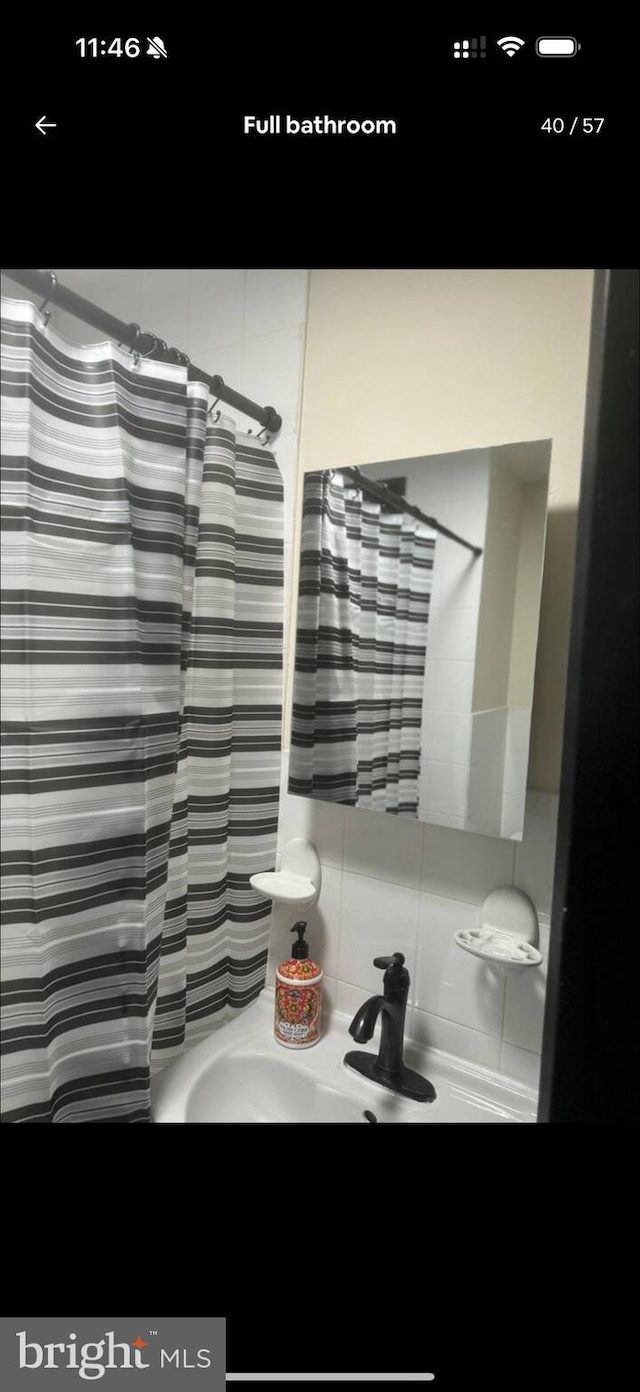 2442 S Philip St, Philadelphia, PA 19148 - full bathroom featuring vanity and a shower with curtain