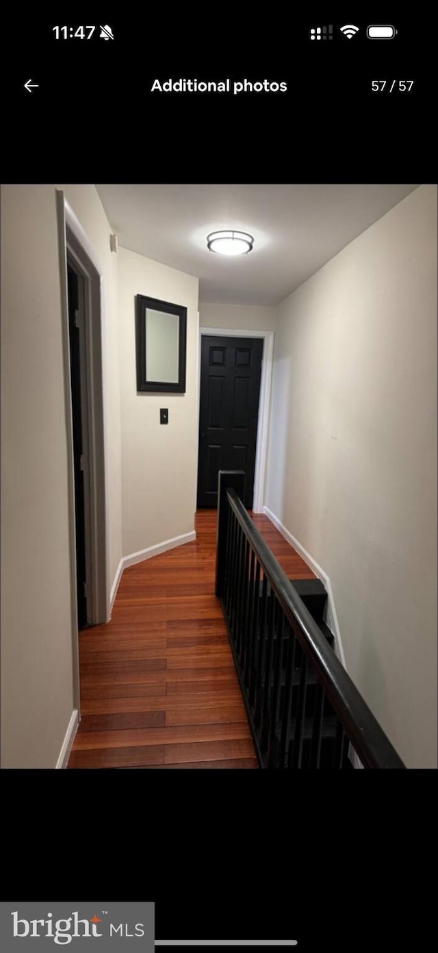 2442 S Philip St, Philadelphia, PA 19148 - hall with wood finished floors and baseboards