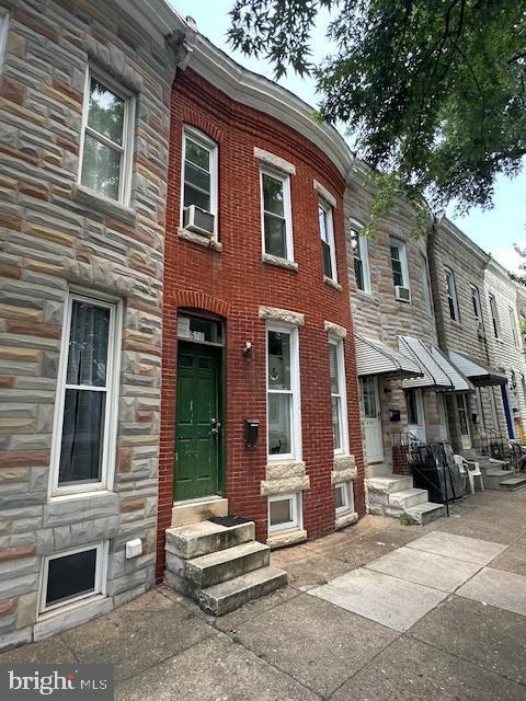 508 W 27th St W, Baltimore, MD 21211 - multi unit property with stone siding, entry steps, and cooling unit