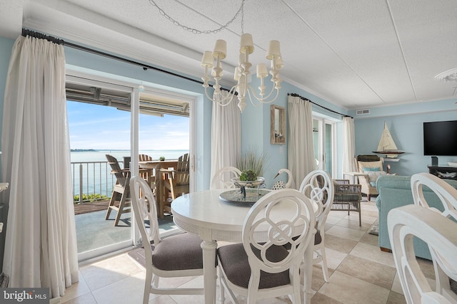 427 14th St Unit 10203, Ocean City, MD 21842 - dining room with a water view, light tile patterned flooring, and a chandelier