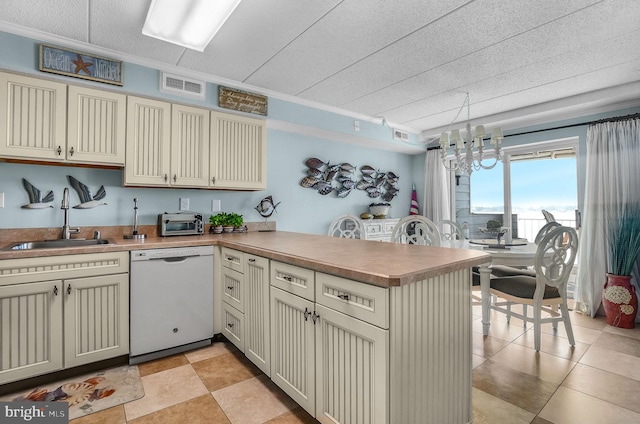 427 14th St Unit 10203, Ocean City, MD 21842 - kitchen with dishwasher, a peninsula, cream cabinets, a chandelier, and light countertops
