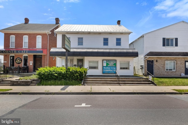 128 E Main St, Palmyra, PA 17078 - view of front of property with a chimney and a metal roof