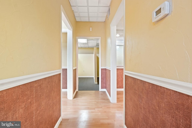 128 E Main St, Palmyra, PA 17078 - hall with wood finished floors, a paneled ceiling, and a wainscoted wall