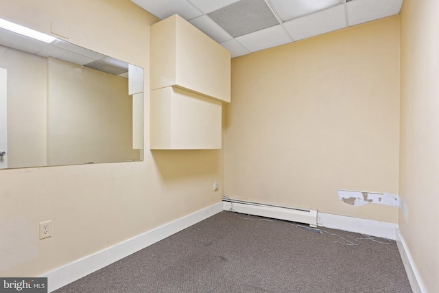 128 E Main St, Palmyra, PA 17078 - carpeted empty room featuring a baseboard heating unit and a paneled ceiling