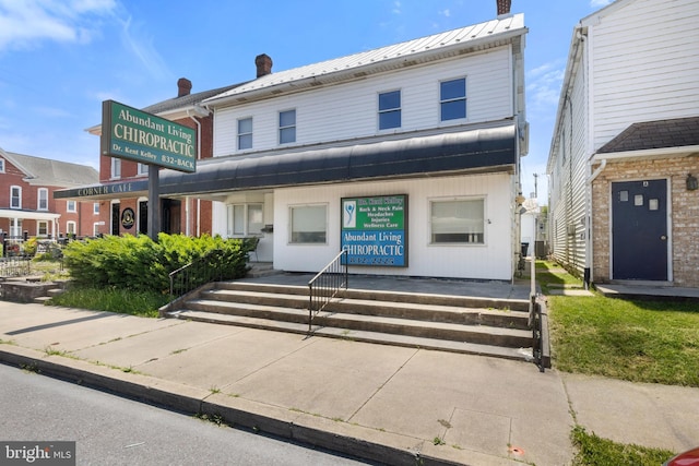 128 E Main St, Palmyra, PA 17078 - view of front of home with a chimney and a metal roof