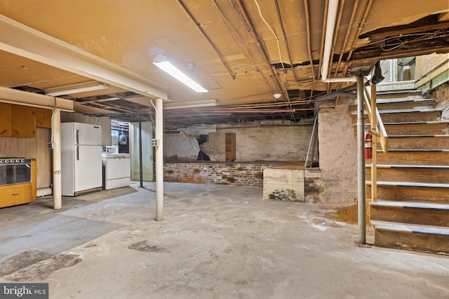 128 E Main St, Palmyra, PA 17078 - unfinished below grade area featuring freestanding refrigerator and stairs