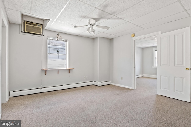 128 E Main St, Palmyra, PA 17078 - carpeted empty room featuring baseboard heating, a paneled ceiling, a wall mounted AC, and a ceiling fan