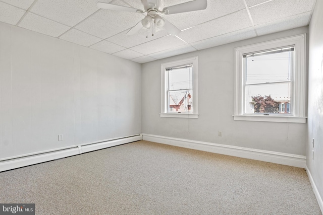 128 E Main St, Palmyra, PA 17078 - empty room featuring a paneled ceiling, carpet flooring, a baseboard heating unit, and ceiling fan