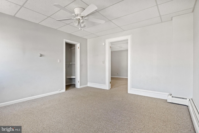 128 E Main St, Palmyra, PA 17078 - spare room featuring carpet floors, a paneled ceiling, and ceiling fan