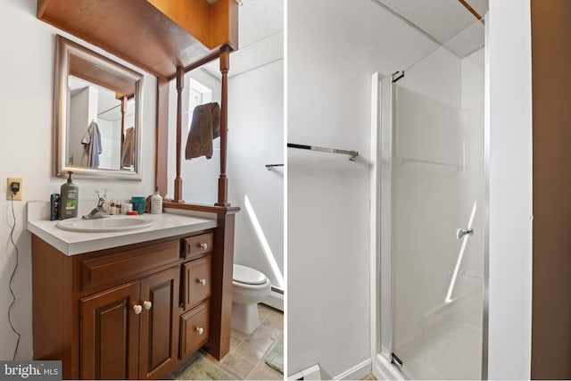 128 E Main St, Palmyra, PA 17078 - bathroom featuring a stall shower, vanity, and baseboard heating