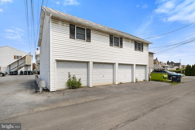 128 E Main St, Palmyra, PA 17078 - garage featuring asphalt driveway
