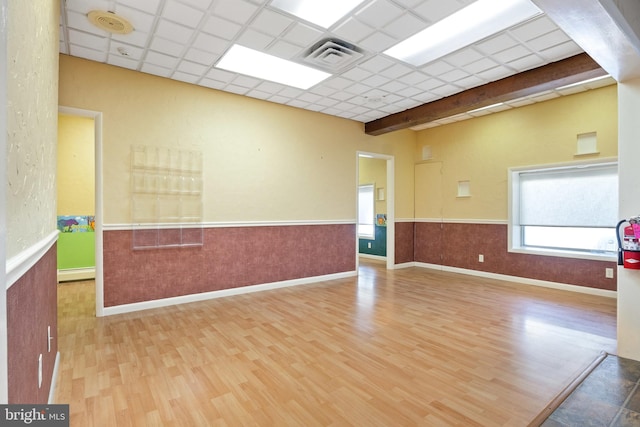 128 E Main St, Palmyra, PA 17078 - spare room with a baseboard heating unit, wood finished floors, wainscoting, healthy amount of natural light, and a smoke detector
