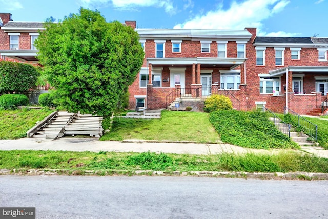 4316 Shamrock Ave, Baltimore, MD 21206 - townhome / multi-family property with stairs, a chimney, and brick siding