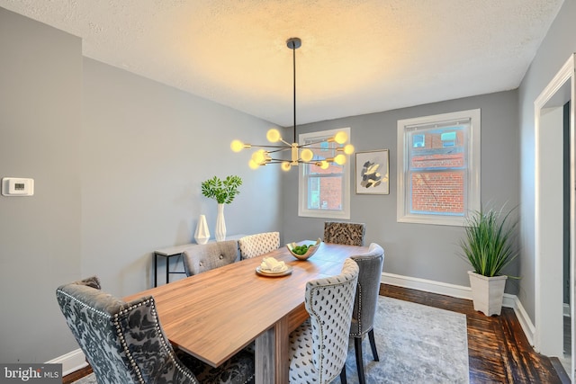 4316 Shamrock Ave, Baltimore, MD 21206 - dining area with wood finished floors, a textured ceiling, and a chandelier