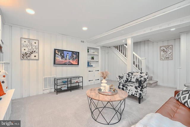 4316 Shamrock Ave, Baltimore, MD 21206 - living room featuring stairway, carpet floors, recessed lighting, a decorative wall, and built in shelves