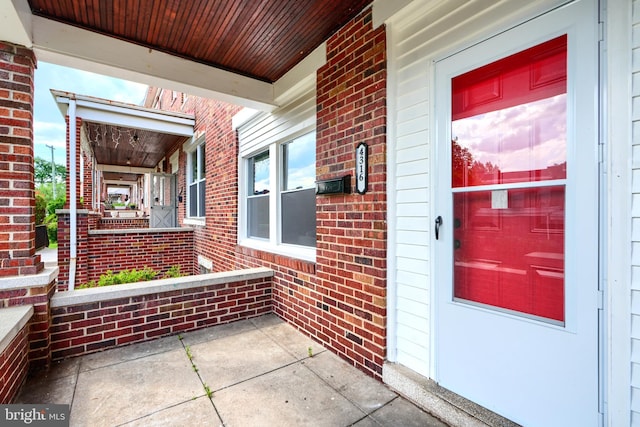 4316 Shamrock Ave, Baltimore, MD 21206 - view of exterior entry featuring covered porch and brick siding