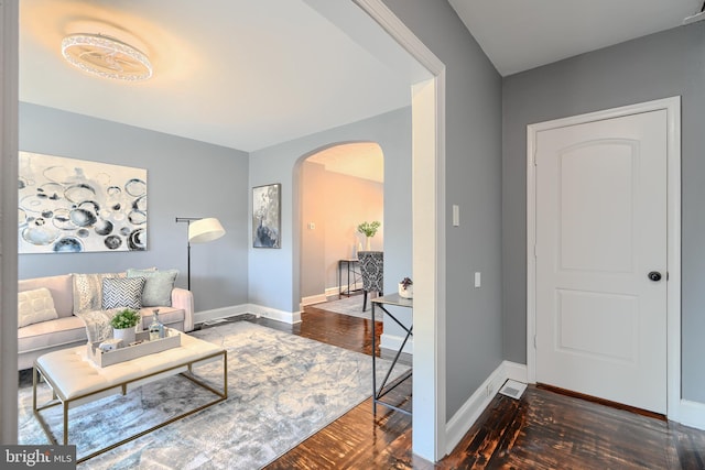 4316 Shamrock Ave, Baltimore, MD 21206 - living area featuring arched walkways and wood finished floors