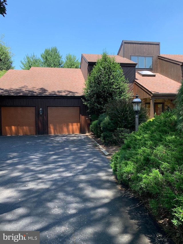 70 Hargrave Ln, Media, PA 19063 - view of front facade featuring a shingled roof and a garage