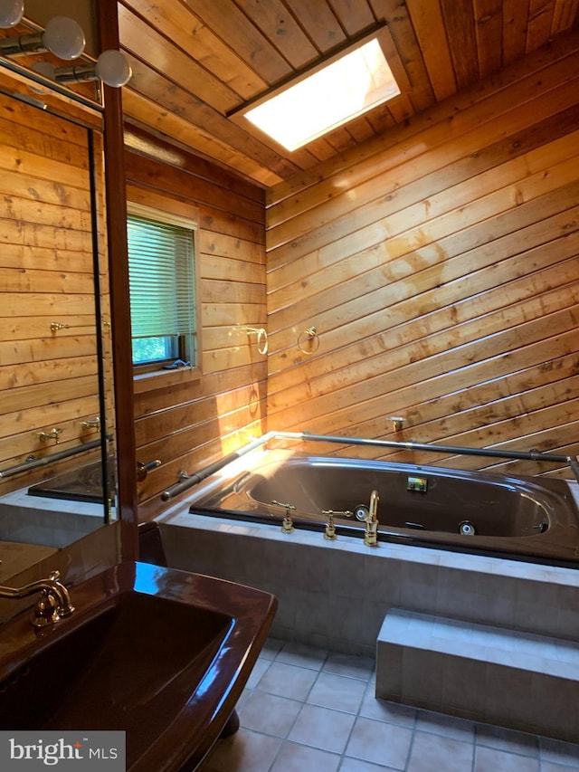 70 Hargrave Ln, Media, PA 19063 - bathroom with wooden ceiling, tile patterned floors, a tub with jets, and wooden walls