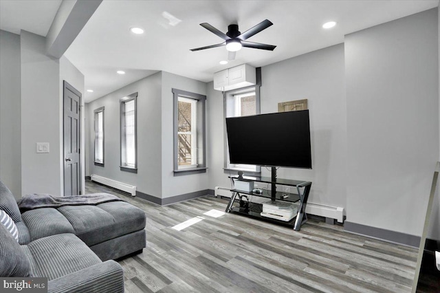 553 Wunder St Fl 1St, Reading, PA 19602 - living area with a baseboard radiator, wood finished floors, recessed lighting, and ceiling fan