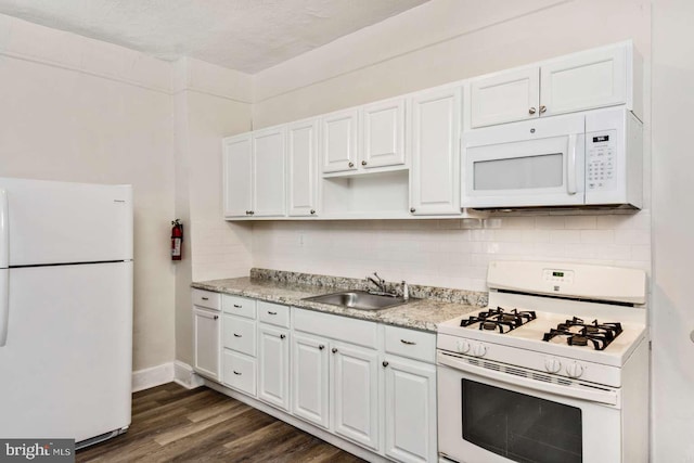 3339 N 21st St, Philadelphia, PA 19140 - kitchen featuring white appliances, decorative backsplash, dark wood-style flooring, white cabinets, and open shelves