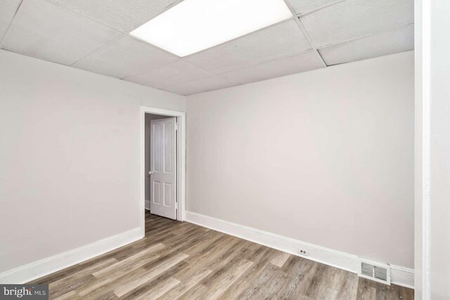 3339 N 21st St, Philadelphia, PA 19140 - spare room with a paneled ceiling and wood finished floors